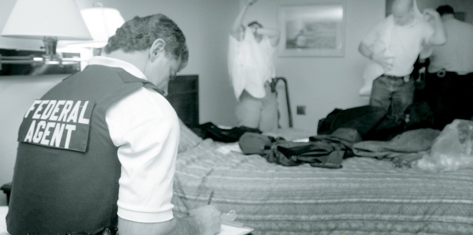 A federal agent taking notes on a crime scene