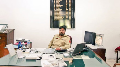 Adil Raja sitting on a table