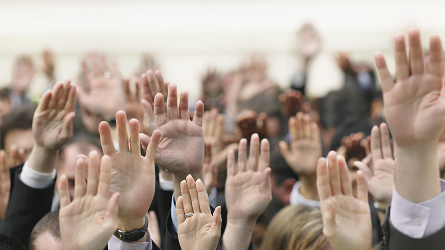Hands raising in the air