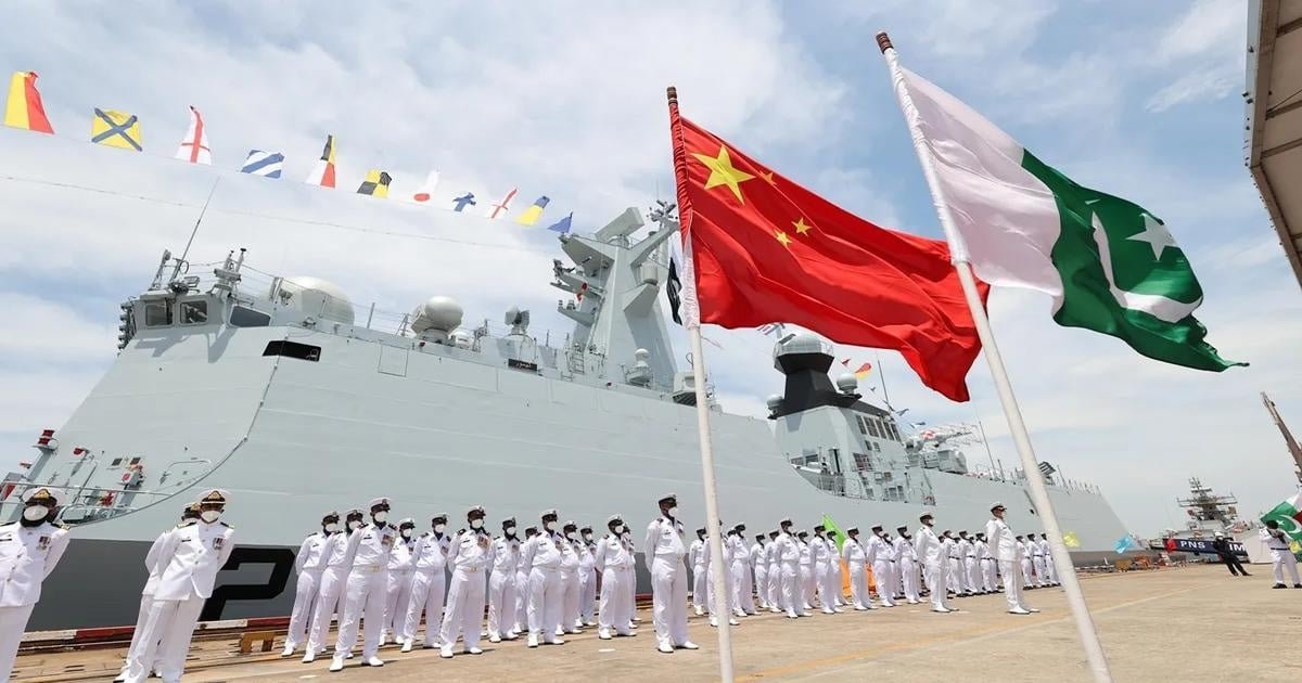 army saluting with chinese flag and pakistan flag