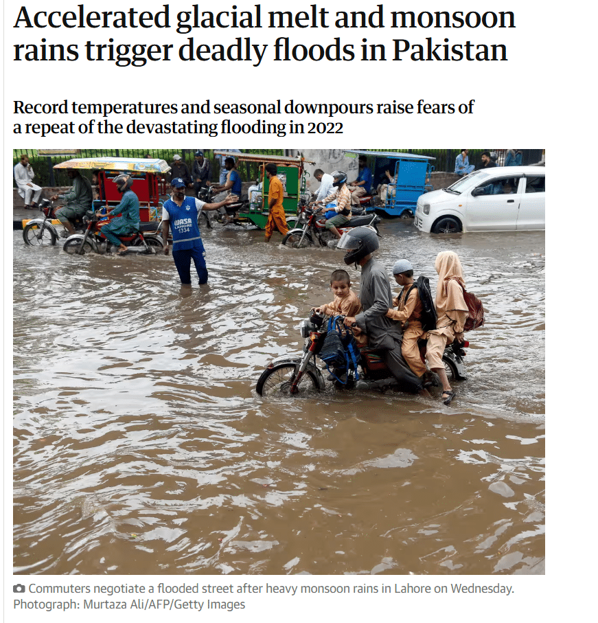 Image shows a flooded street in an urban area.
