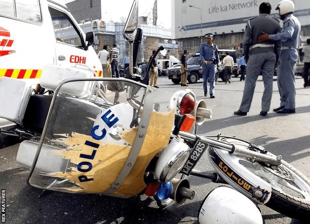 damaged police motorbike due to bomb blast.