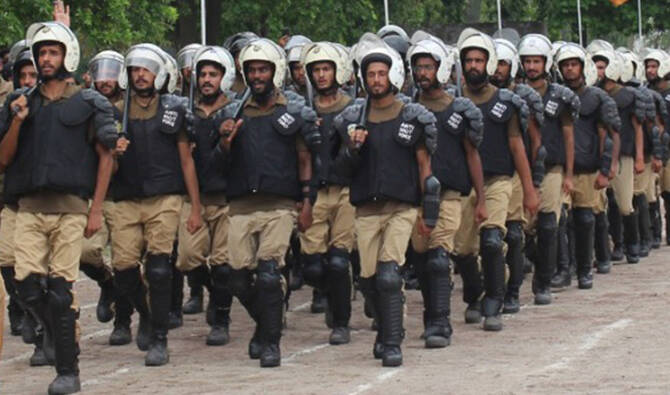 In this handout photograph released by Punjab Police on July 10, 2025, Riot Management Police personnel participate in a passing-out parade at the Police Training School in Sheikhupura district, Punjab, Pakistan