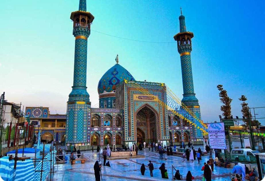 Pilgrims offering their prayers at a shrine in Iran 