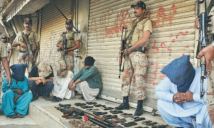 Police apprehending criminals during the targeted operation in Karachi