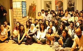 A group photo of students at a tea stall. 