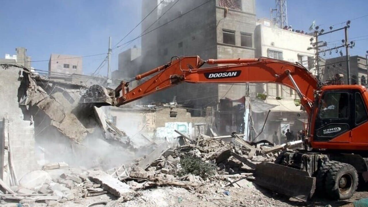 A Bulldozer demolishing illegal Afghan Camp in Karachi