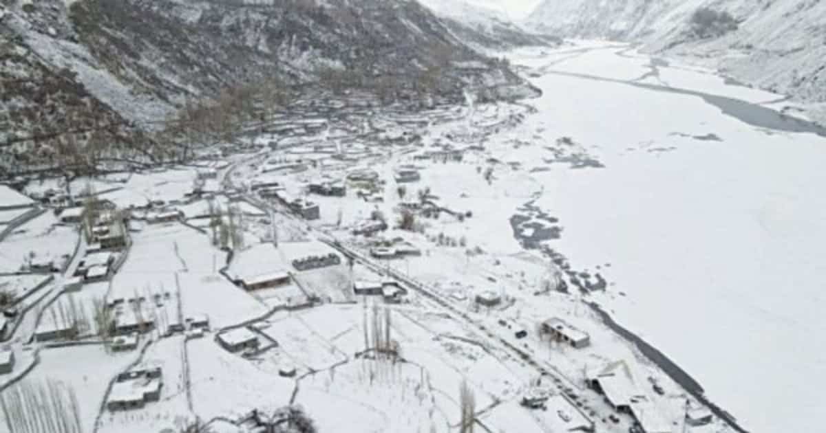 Snow-covered village in mountainous landscape in northern pakistan