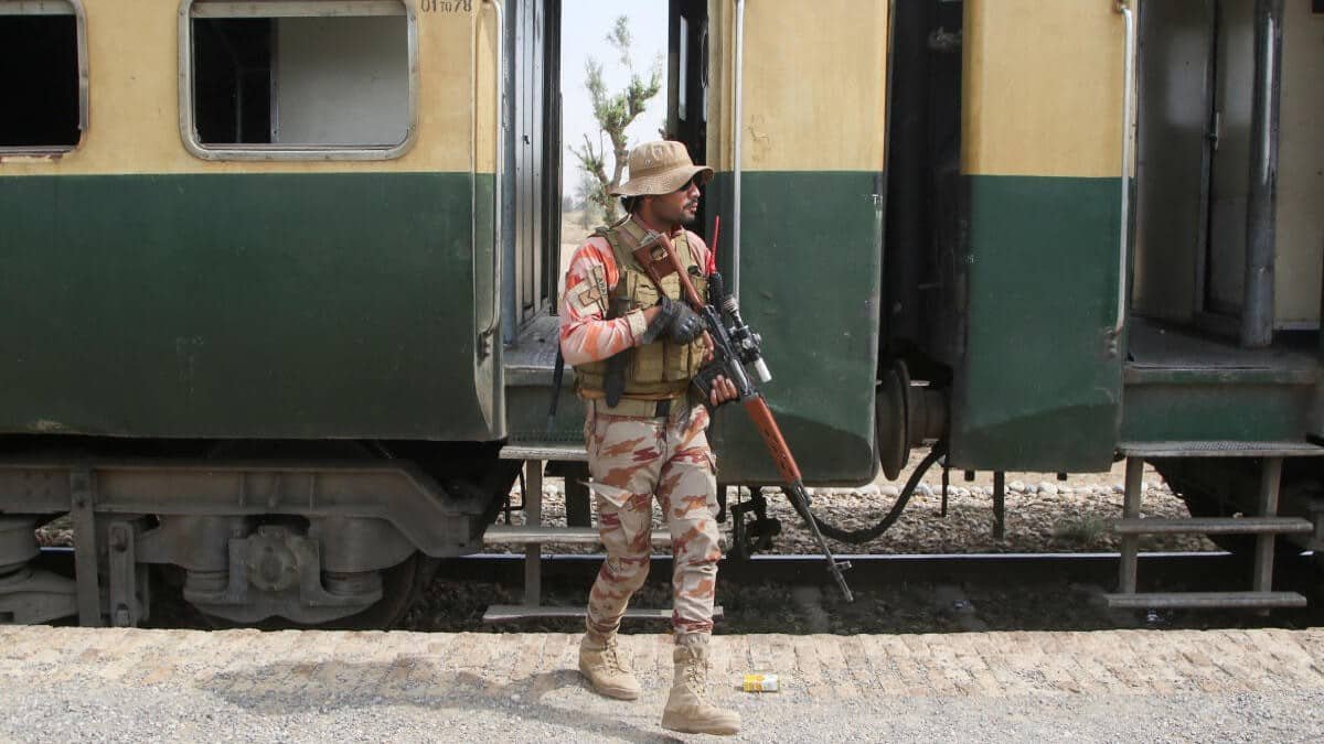 A Pakistani Army personnel standing infront of a train. 35 terrorists killed, three commanders captured in major Quetta operation